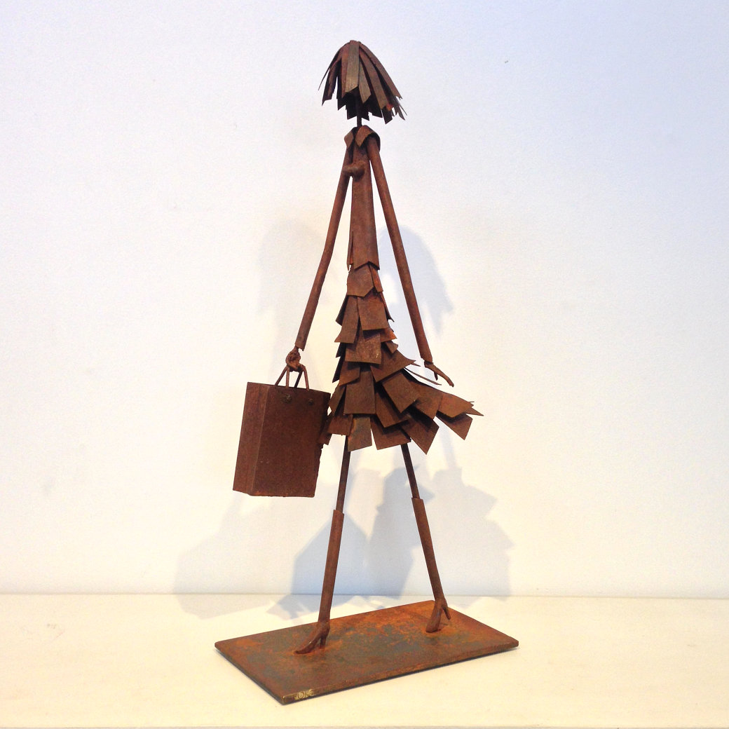 steel sculpture of girl shopping by Tony O'Keefe, Queenstown New Zealand